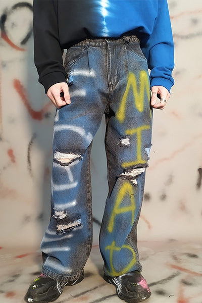 Dark black inkjet letter graffiti print distressed hole ripped washed out loose fit jeans